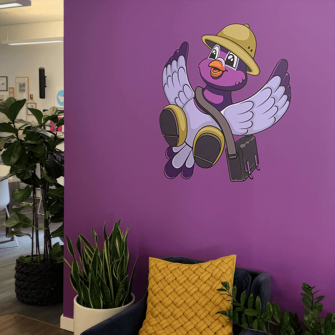 A large Pip decal soars on an office wall.