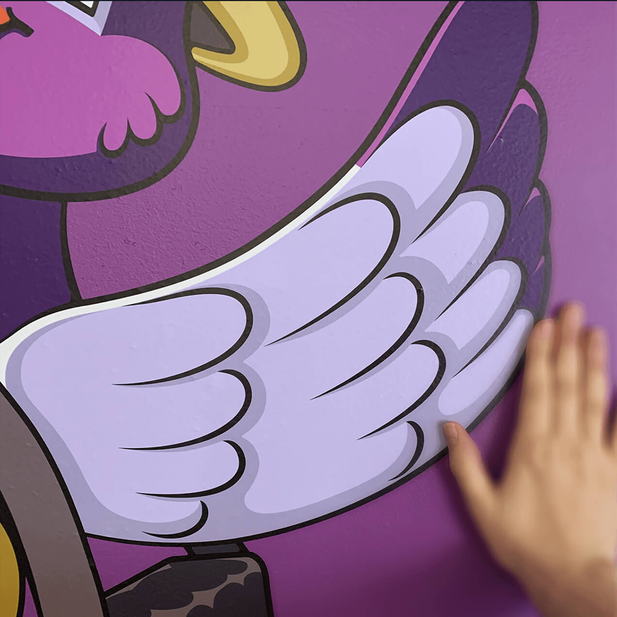 A close-up of a large Pip decal that soars on an office wall.