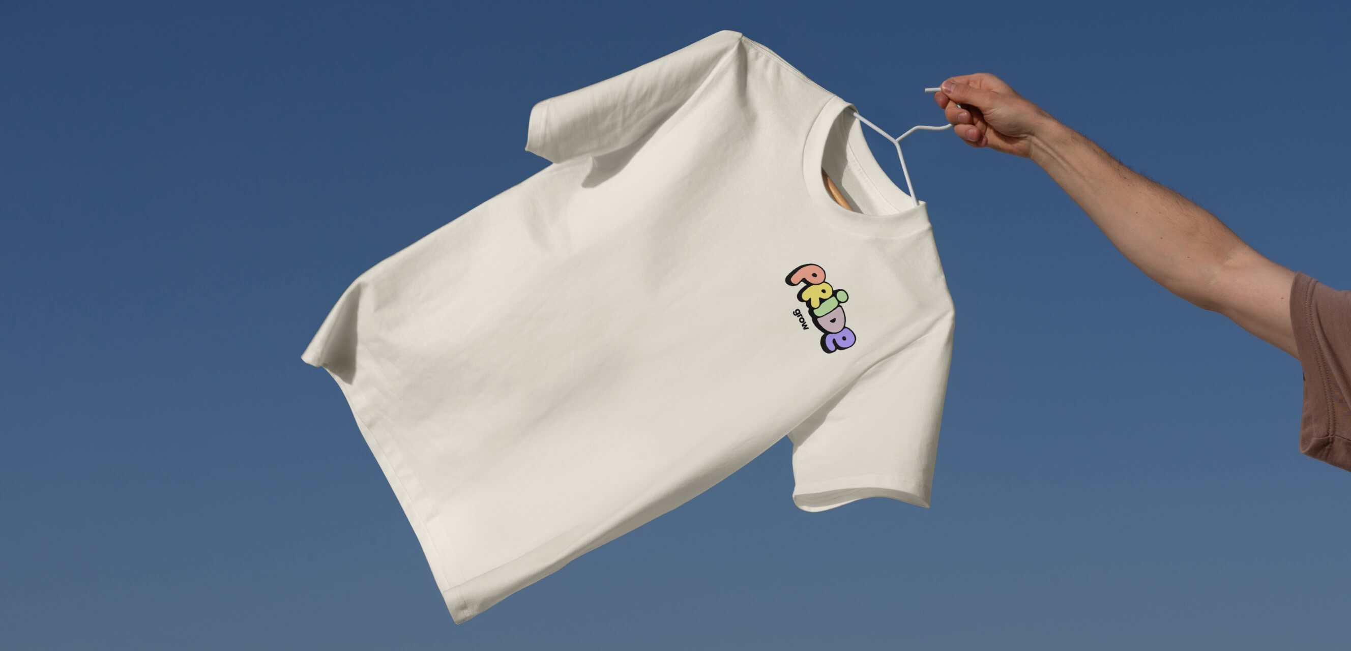 Image of the Grow Forward stage: four green empty chairs with pink and purple pillows, surrounded by foliage, and illuminated by a neon Grow Forward sign.